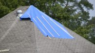 tarp on roof covering leak area