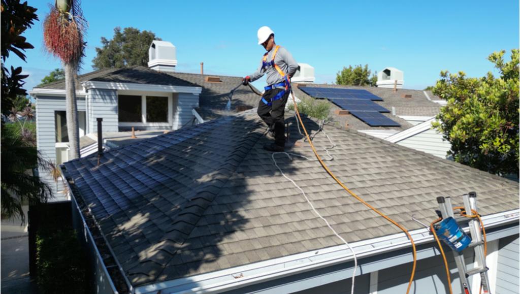 A Roof Maxx dealer restores a customer's asphalt shingle roof.