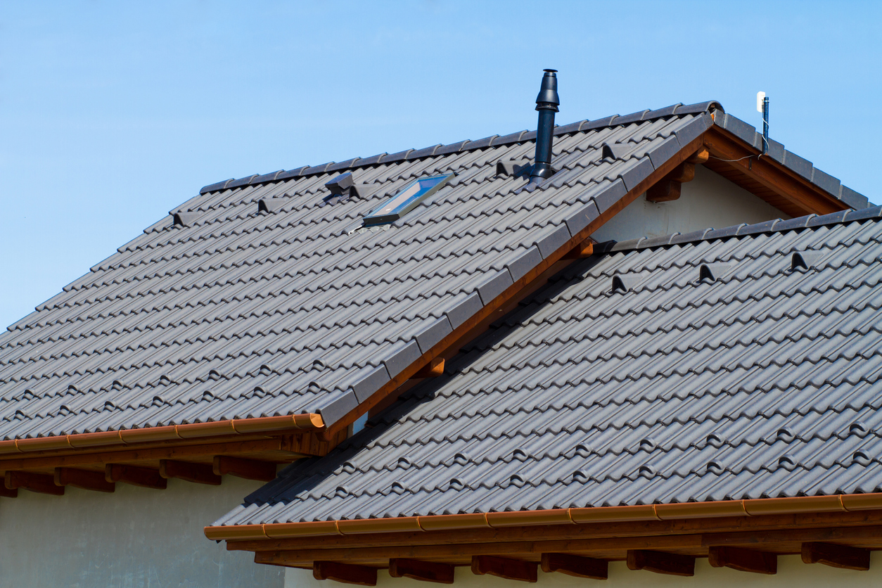 Side view of a roof with concrete shingles designed to look like clay tiles