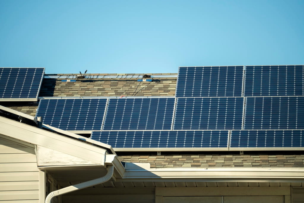 Solar panels on asphalt shingle roof to provide energy efficiency and protection for homeowners