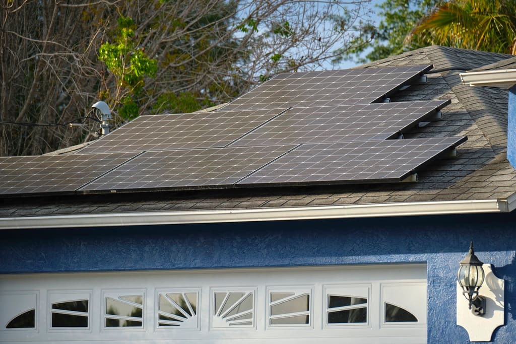 Garage of US home with solar panels installed properly on top to help prevent damage and provide energy