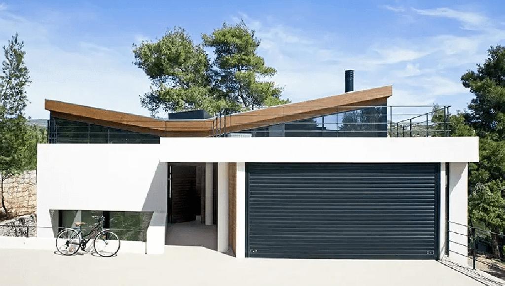 A modern or contemporary style butterfly roof on a small home.