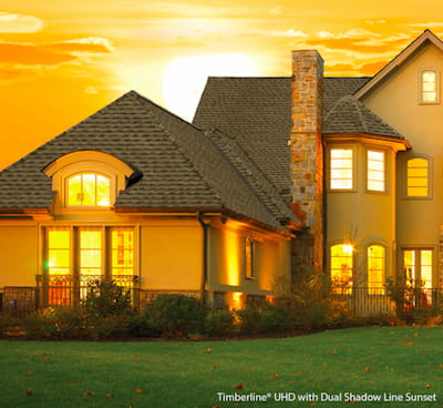 Timberline UHD shingles on a residential home at sunset