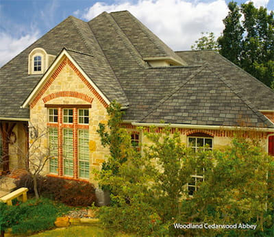 Woodland shingles on a residential house with stone facade
