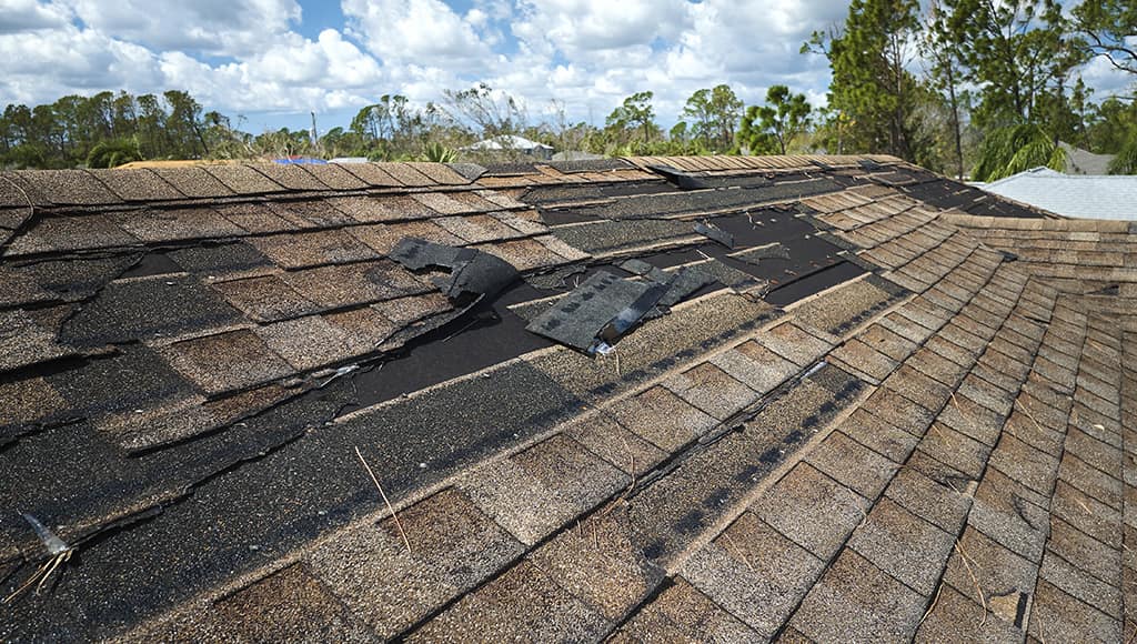 A sunken in roof missing shingles