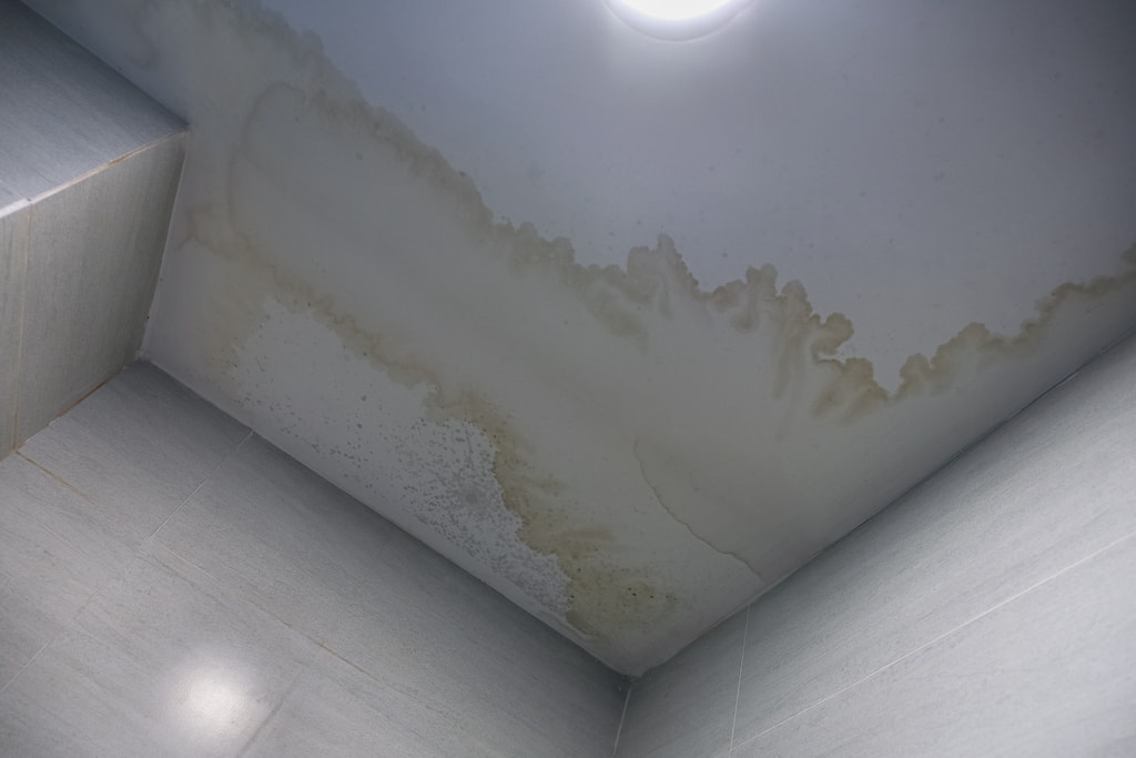 Stain caused by water damage on ceiling of home.