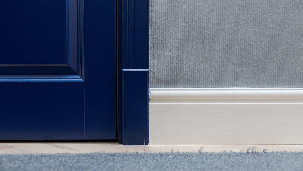 Gaps under a front door that allow drafts to enter the home.