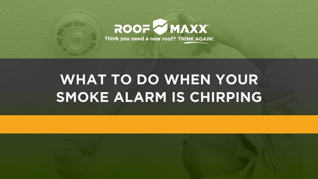 Title image with the Roof Maxx logo and title "What to Do When Your Smoke Alarm Is Chirping" on a green transparency over an image of a woman checking her smoke detector.