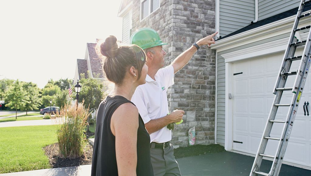 A roofer explains the difference between 5-inch and 6-inch gutters.