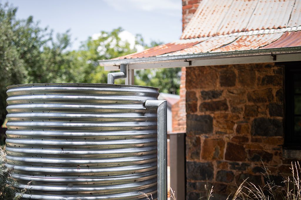 A rainwater tank that collects water from the roof of a home