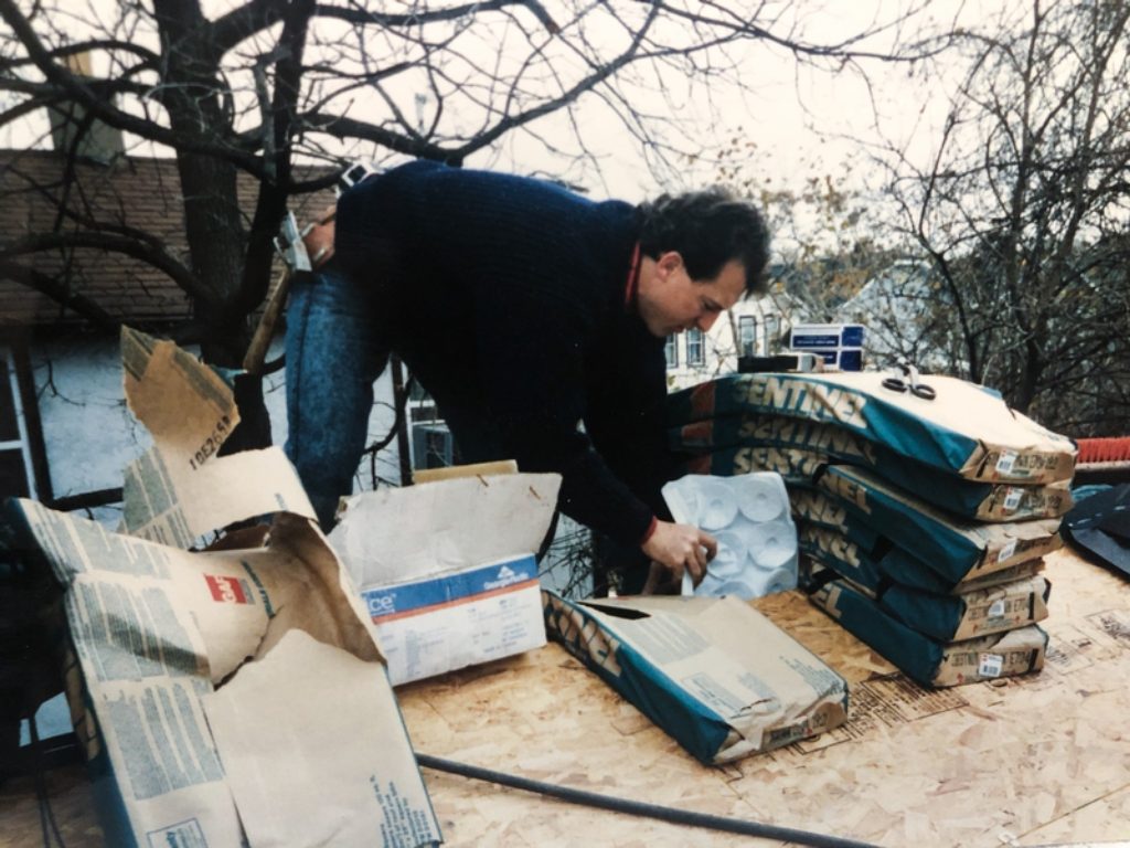 Early photo of Todd Feazel working with his roofing company