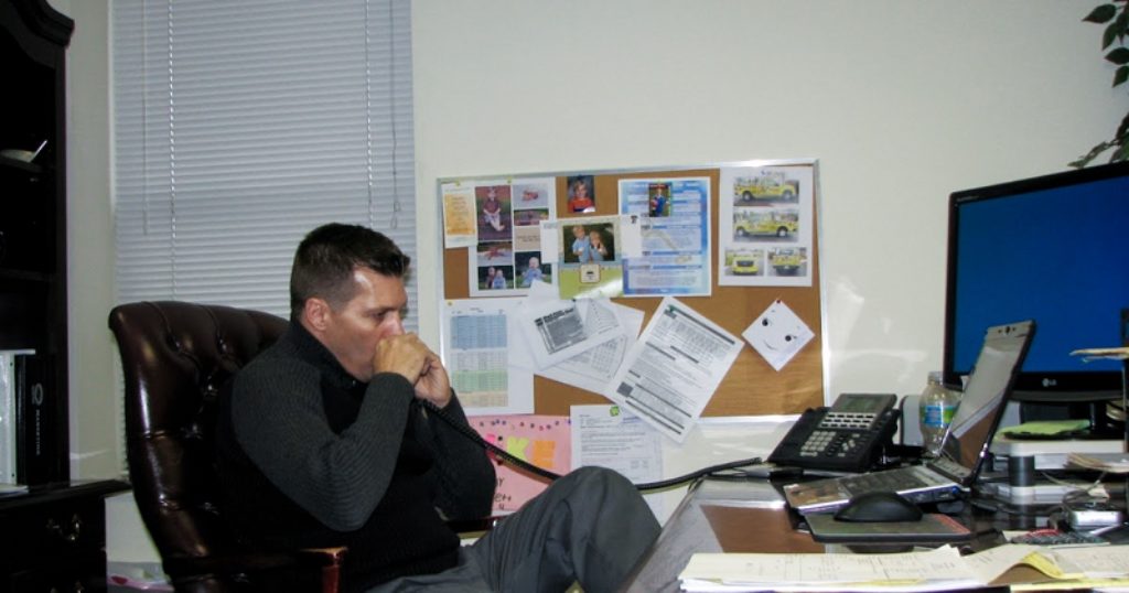 Mike Feazel in his office during the early days of what would become Roof Maxx
