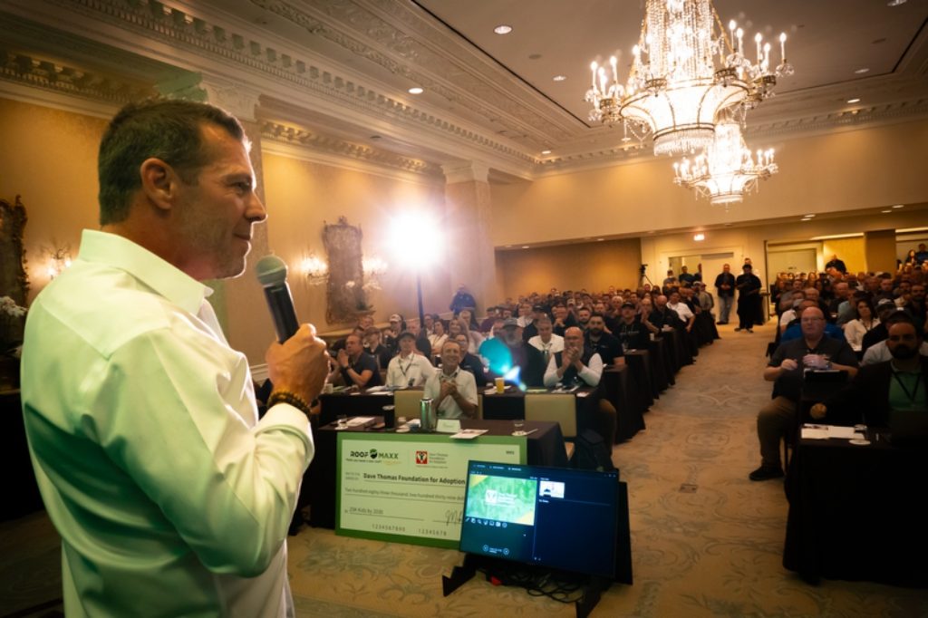 Mike Feazel speaks at the Roof Maxx 2025 National Dealer Conference in New Orleans Louisiana