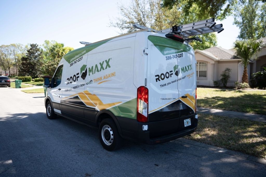 Roof Maxx van parked outside of investment property