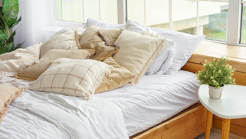 A delightfully cozy bed with organic cotton sheets and blankets.