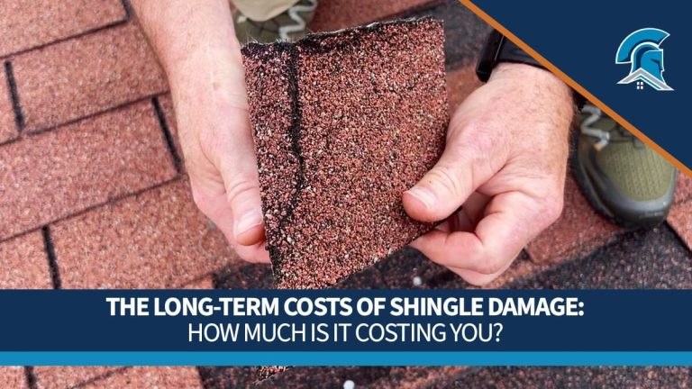 Hands holding a damaged asphalt shingle with text overlay about the long-term costs of shingle damage.