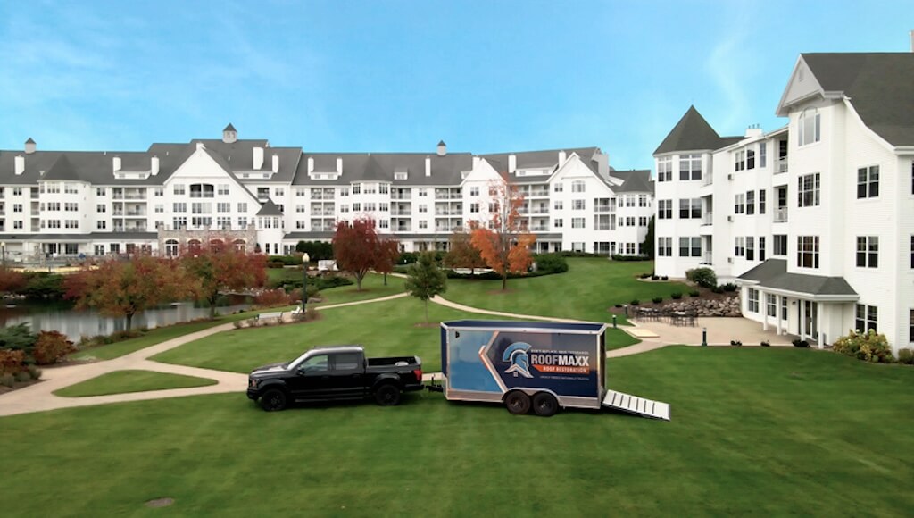 Aerial view of the Osthoff resort with a Roof Maxx branded trailer and truck on the lawn.