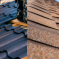 side by side photo of metal roofing and asphalt roof.