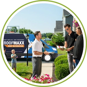 A Roof Maxx dealer stops to talk with a homeowner about roof maintenance.